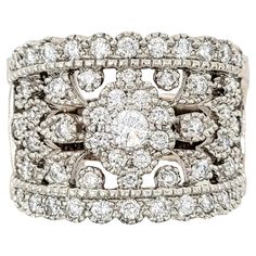 Ring size: 7.75 This beautiful, ornate diamond band ring fills the finger with shimmering sparkle. The flower cluster at the center is surrounded by intricate cut outs and subtle milgrain detailing, while the exceptional diamonds glitter from every angle. Though it is wide in size, it remains delicate and feminine while making a big statement on the finger. Ring size: 7.75 Metal: 14K White Gold Weight: 13.12 grams Diamonds: 1.425 ctw Diamond cut: Round Brilliant Diamond color: E-F Diamond clarit Diamond Band Ring, Flower Cluster, Diamond Glitter, Diamond Ring Settings, Wide Band Rings, Diamond Rings Bands, Finger Ring, Diamond Band, Diamond Color