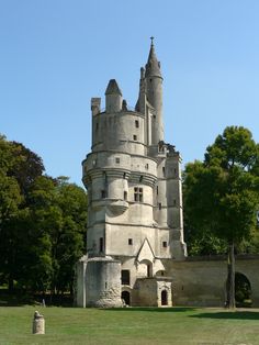 an old castle like structure in the middle of a park