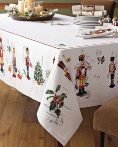 a christmas table cloth with nutcrackers on it