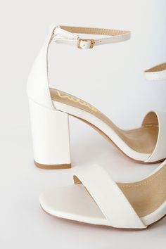 You're certain to step up your style essentials when you add the Lulus Arylee White Ankle Strap Heels to your closet! Smooth faux leather shapes a single toe strap, almond-shaped toe bed, and wrapped block heel. A dainty ankle strap rises from the sturdy heel cup and secures with a gold buckle. 3. 25" wrapped block heel. Cushioned insole. Rubber sole has nonskid markings. All Man Made Materials. Imported. Lulus | Arylee White Ankle Strap Heels | Size 9. White Ankle Strap Heels, White Block Heels, White Sandals Heels, Ankle Strap Block Heel, Floral Print Pants, Style Essentials, Faux Leather Heels, Size 11 Heels, Almond Shaped