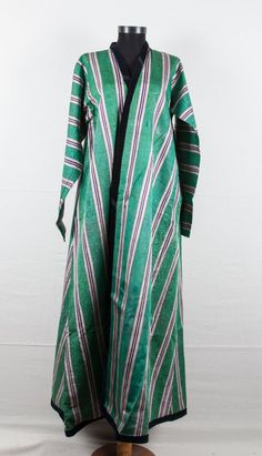 Vintage Uzbek silk and cotton coat 5'4''x by SOrugsandtextiles Fitted Long Sleeve Kaftan For Ceremonial Occasions, Traditional Silk Long Sleeve Outerwear, Ceremonial Long Sleeve Outerwear For Fall, Traditional Green Stand Collar Outerwear, Traditional Green Outerwear With Stand Collar, Green Silk Long Sleeve Outerwear, Fitted Long Sleeve Green Abaya, Long Sleeve Green Robe For Fall, Green Fitted Long Sleeve Abaya