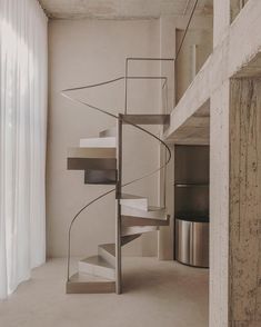 a spiral staircase in the middle of a room