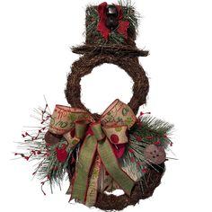 a christmas wreath with a snowman hat on top