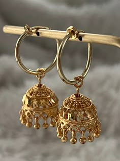 Gold Clip-on Jewelry For Festive Occasions, Festive Gold Clip-on Jewelry, Traditional Chandbali Clip-on Earrings, Festive Intricate Design Dangle Hoop Earrings, Festive Intricate Hoop Earrings Dangle, Festive Gold Plated Hoop Earrings, Gold Dangle Clip-on Earrings With Latkans, Festive Gold Plated Dangle Hoop Earrings, Elegant Hoop Danglers With Latkans