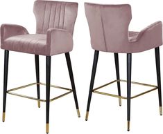 two pink velvet bar stools with gold legs