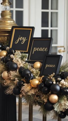 black and gold christmas garland with joy peace and peace signs