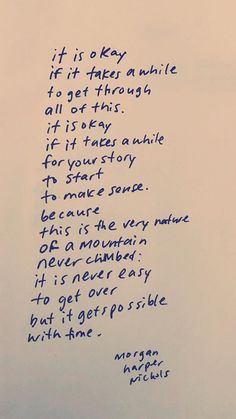 a poem written in blue ink on a white sheet of paper with writing underneath it