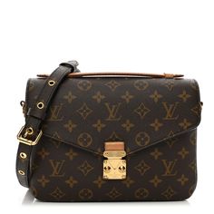 This is an authentic LOUIS VUITTON Monogram Pochette Metis This chic handbag is finely crafted of classic Louis Vuitton monogram coated toile canvas in brown. The bag features a vachetta cowhide leather top handle, a removable, adjustable monogram coated canvas shoulder strap and a rear zipper pocket. The envelope-style crossover flap opens with a polished gold S-lock to a partitioned brown microfiber interior. Chic Handbags, Leather Top, Authentic Louis Vuitton, Cowhide Leather, Louis Vuitton Monogram, Crossover, Zipper Pocket, Top Handle, Shoulder Strap