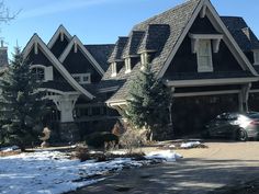 a car parked in front of a large house