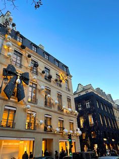 a large building with christmas decorations hanging from it's sides