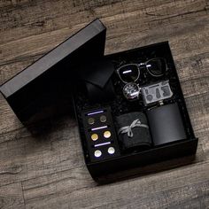 an open black box with various items inside