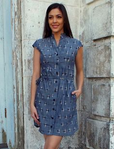 Passion Lilie fair trade 100% cotton grey button up t-shirt like chambray ikat dress with a stand up collar, cap sleeves, optional fabric belt, and side pockets. Designed in New Orleans. Handwoven and ikat dyed in India. Lovely Grey, Cotton Short Dresses, Ikat Dress, Fair Trade Clothing, Chambray Fabric, Organic Cotton Dress, Mod Style, Blue Sleeveless Dress, Capped Sleeves