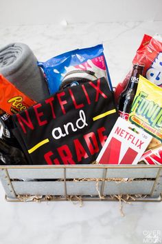 a metal basket filled with snacks and other items