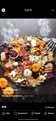 a plate full of different types of food on top of a wooden table with a fork stuck in it