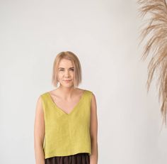 "Relaxed fit sleeveless linen crop top with wide V-neck creates a romantic and careless look. Because of its versatility suitable in many combinations and for various occassions. Something that doesn't require time or effort to make you look stylish and subtly seductive. DETAILS - Relaxed fit - Fits true to size - can be made shorter or longer depending on your preference - Wide V neckline - Sleeveless - 100% midweight 185 g/m2 European softened linen fabric - Oeko Tex certified linen - Various Sleeveless Linen Crop Top For Spring, Casual Linen V-neck Crop Top, Summer Linen V-neck Crop Top, Summer Linen Crop Top With V-neck, Linen Crop Top, Linen Crops, Linen Tank Top, Linen Tank, Linen Blouse