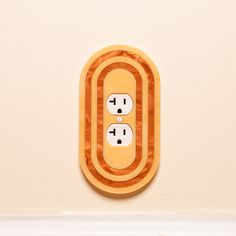 an electrical outlet on the wall with two plugs