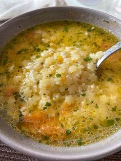 a white bowl filled with soup on top of a table