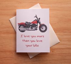 a card with a motorcycle on it that says i love you more than you love your bike