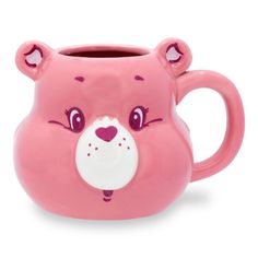 a pink mug with a bear face on it