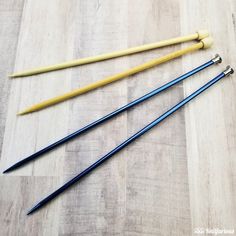 three different types of knitting needles on a wood floor with text overlay that reads, how to use knitting needles