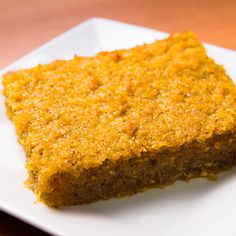 a square piece of cake on a white plate