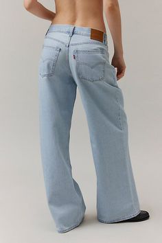 Vintage-inspired Dad jeans from Levi’s® with a perfectly broken-in feel. Cut in a mid-rise silhouette with a slouchy straight leg that puddles at the hem. Features Levi’s® dad jeans a mid-rise and a loose and relaxed wide-leg Crafted from rigid denim that will soften over time Logo patch at the back Zip fly Content + Care 100% Cotton Machine wash Imported Size + Fit Mid rise Wide leg Full length Model in Light Blue is 5’8" and wearing size 27 Measurements taken from size 28 Rise: 10.5" Inseam: 32" Leg opening: 26" | Levi's Novel Baggy Dad Jean in Light Blue, Women's at Urban Outfitters Levi’s Baggy Jeans, Levi’s Baggy Dad Jeans Outfit, Light Washed Jeans Outfit, Levis Baggy Dad Jeans, Vintage Jeans Outfit, Baggy Jeans For Women, Best Jeans For Women