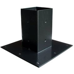 a black metal shelf with two holes on it