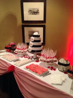 a table topped with lots of desserts and candies