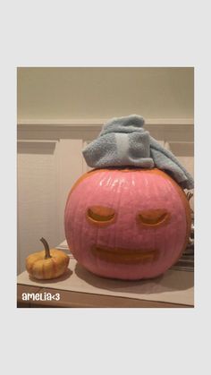 a large pumpkin sitting on top of a table