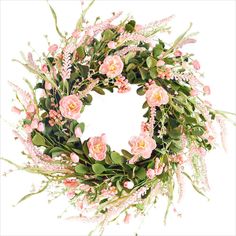 a wreath with pink flowers and greenery on it is displayed against a white background