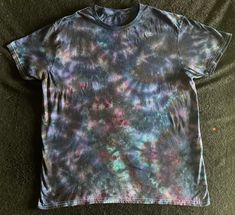 a t - shirt that has been dyed with multicolored dyes on it