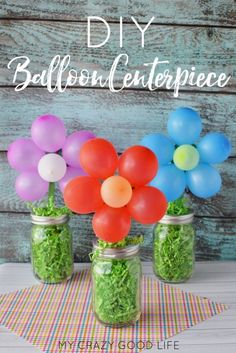 three mason jars filled with balloons and grass