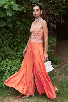 Tangerine orange sleeveless jumpsuit crafted in chanderi cotton silk with synodic embroidery on the yoke using sequins, beads and cutdana highlights. - Aza Fashions Orange Jumpsuit, Embroidered Jumpsuit, Embroidery Beads, Jumpsuit For Women, Sequin Jumpsuit, Jumpsuit Online, Tangerine Orange, Silk Embroidery, Sleeveless Jumpsuits