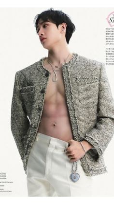 a shirtless man in a tweed jacket and white pants