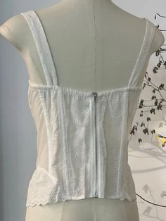 This is perfect for those who are looking for a clothing for a good price. It is fashionable, stylish, and it will look great on anyone who wears it. Do you wanahavit? White Summer Tops With Built-in Bra, White Tank Top With Built-in Bra For Day Out, White Lace Cotton Tank Top, White Cotton Camisole For Day Out, White Lace Trim Tank Top For Day Out, Summer White Lace Camisole, White Vest Top For Daywear, White Lace Summer Camisole, White Cotton Chic Camisole