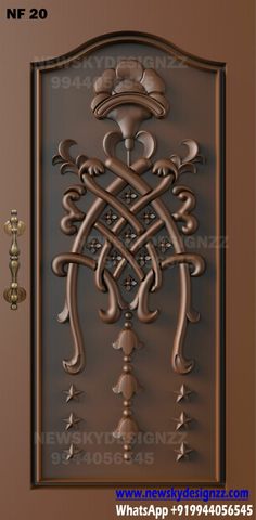 an ornate metal door with decorative designs on it