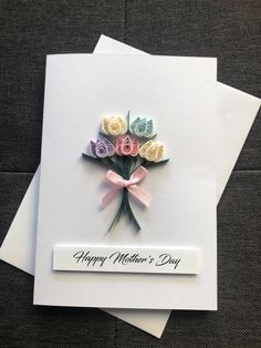 a mother's day card with flowers on it