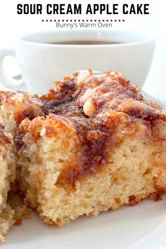 Sour Cream Apple Cake sitting on a white plate Apple Coffeecake Recipe, Mahjong Snacks, Sour Cream Apple Cake, Homemade Cream Cheese Recipe, Sour Cream Desserts, Homemade Cream Cheese