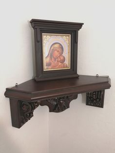 a wooden shelf with a painting on it