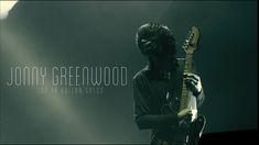 a man holding a guitar in his right hand and the words, tony greiwood top 10 alternative solos