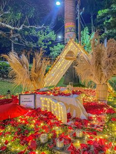 an elaborate display in the middle of a garden at night