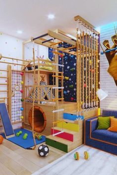 a child's play room with toys and accessories on the floor, including a climbing wall