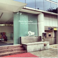 an entrance to a building with stairs leading up to it