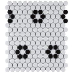 a white and black tile with circles on it