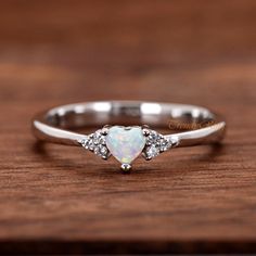 925 Sterling Silver 4mm Small White Opal Heart CZ with Clear CZ Sides Girls Womens Birthday Ring Size 4-10 ▷Gift Box Included ▷4.5mm Height ▷Size 4 - 10 Available ▷925 Sterling Silver (not plated or filled) ▷925 Stamp Authenticity ▷High-Quality Cubic Zirconia Used https://www.etsy.com/shop/TrendyRing Heart-shaped White Gold Birthstone Ring For Valentine's Day, Adjustable Silver Birthstone Ring For Valentine's Day, Valentine's Day Silver Heart Birthstone Ring, Silver Heart-shaped Birthstone Ring Gift, White Gold Birthstone Ring For Valentine's Day, Valentine's Day White Gold Heart Ring With Birthstone, Valentine's Day White Gold Birthstone Ring, Gift Silver Opal Ring With Diamond Accents, Heart Shaped Silver Birthstone Ring For Mother's Day