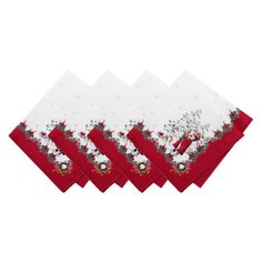 four red and white napkins with christmas decorations on them