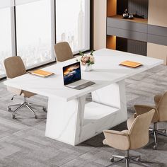 a white table with four chairs and a laptop on it in an office setting overlooking the city