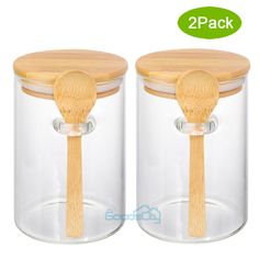 two jars with wooden spoons in them