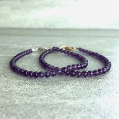 This gemstone bracelet features natural amethyst crystals. The smooth Amethyst beads are a lovely deep purple. The simple design allows the beauty of the stones to shine. This bracelet is perfect on its own, or stacked with your favorite bracelets. At checkout, choose a silver or gold clasp for your bracelet. * METAPHYSICAL PROPERTIES OF AMETHYST * balance courage peace protection temperance wisdom Free gift with every crystal jewelry purchase from Gems by Kelley: a beautiful card with the metap Everyday Purple Round Beaded Bracelets, Rondelle Amethyst Beaded Bracelets With Natural Stones, Rondelle Amethyst Natural Stones Beaded Bracelets, Purple Bracelets With Natural Stones, Everyday Purple Bracelets With Natural Stones, Everyday Amethyst Natural Stone Bracelets, Everyday Amethyst Natural Stone Bracelet, Everyday Purple Amethyst Bracelet, Amethyst Beaded Bracelets With Faceted Beads