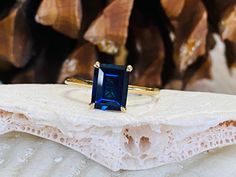 This classic 4 prong setting contains a beautiful 3.00ct. lab created emerald cut sapphire. The stone measures approximately 9x7mm. The ring is available in sterling silver, and 14k white, yellow, or rose gold.  This ring makes a great promise or engagement ring.  Please send me a message if you need a size not listed.  All items are handmade by me in my shop in Manalapan, NJ.  Please message me with any questions. Shipping within the United States is complimentary.   Thank you for exploring my Emerald Cut Sapphire Ring, Deco Rings, Engagement Ring Solitaire, Ring Sapphire, Lab Created Emerald, Sapphire Engagement Ring, Ring Ideas, September Birthstone